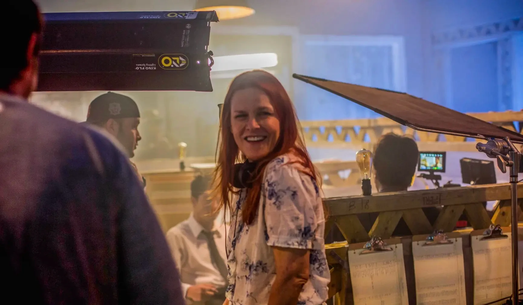 Anne Welles laughing on set during production