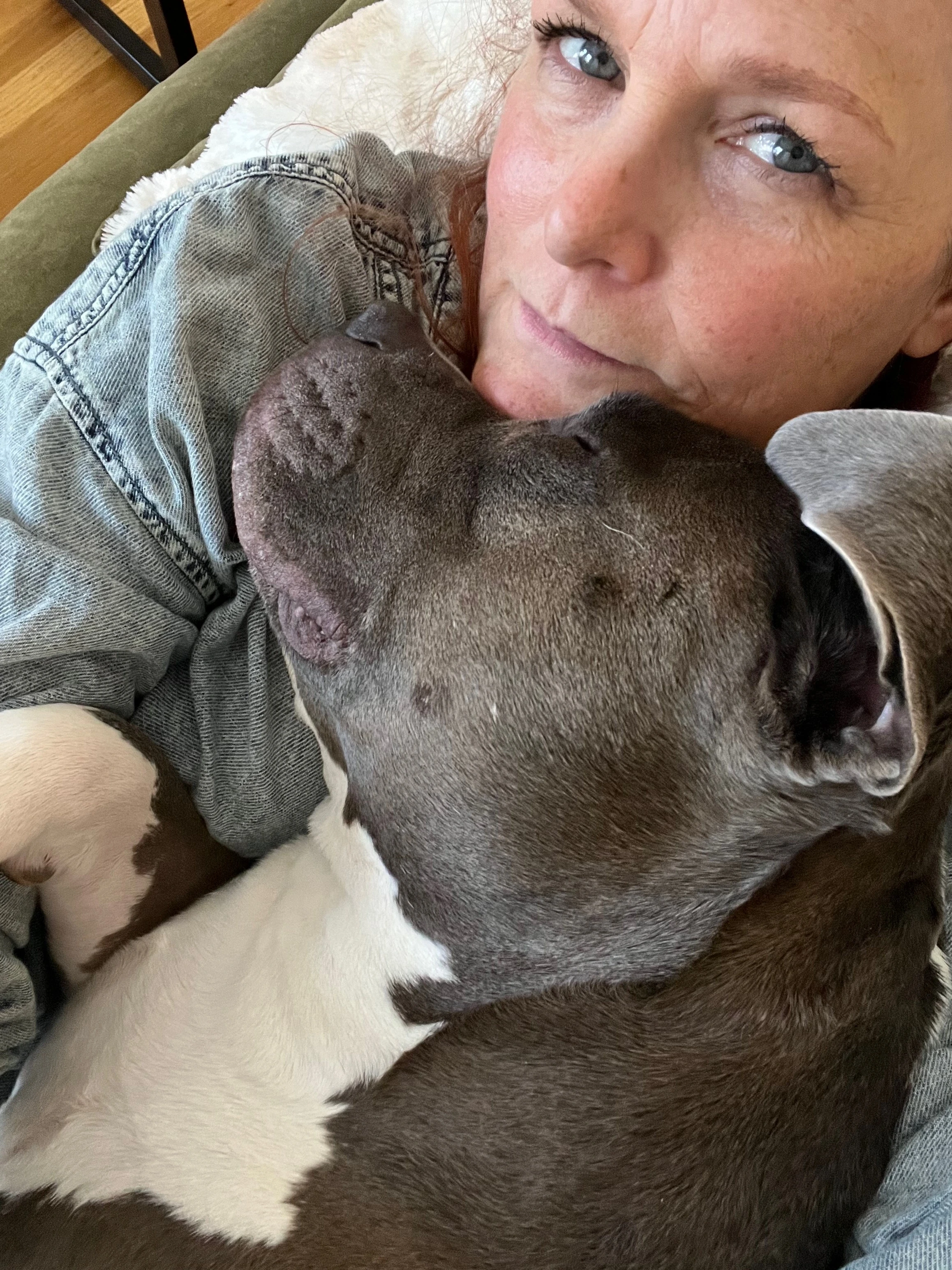Anne cuddling with her dog Boosie