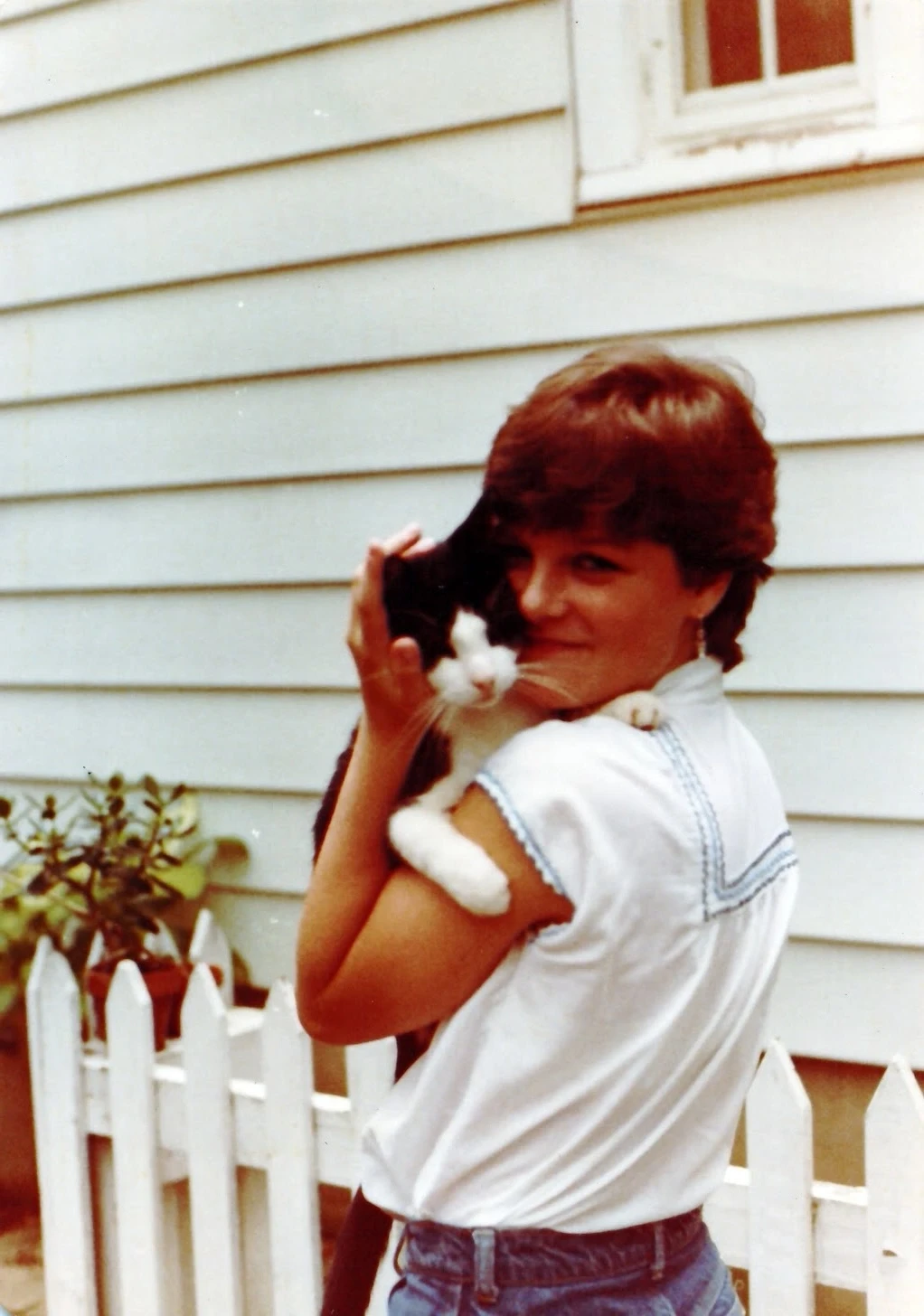 Teenage Anne holding a cat