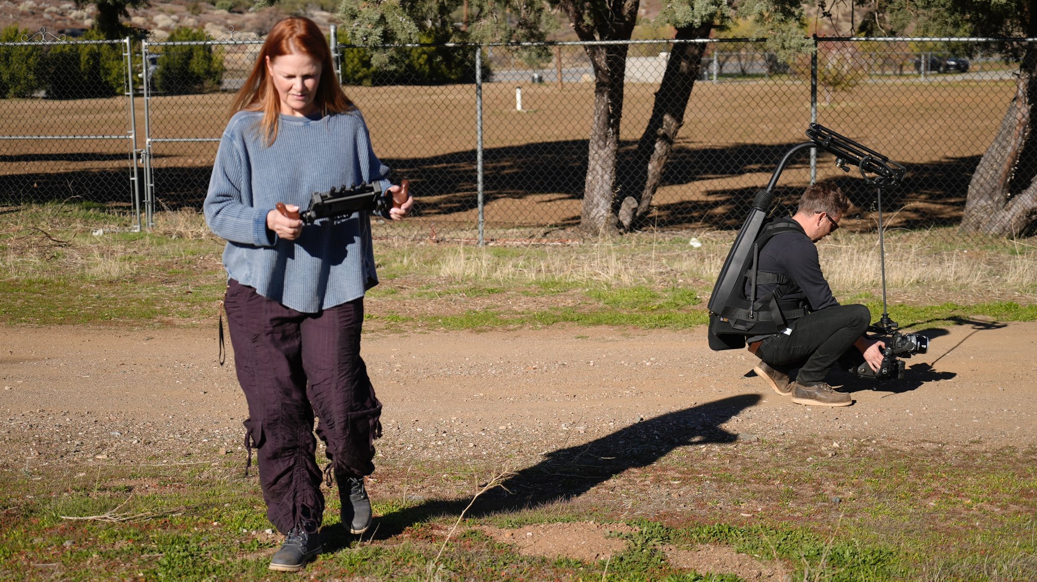 Behind the scenes — actress and steadicam operator filming exterior scene